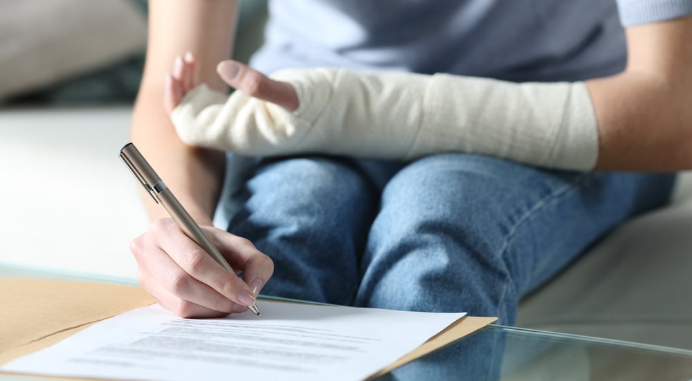 Photo of a Woman Singning Forms